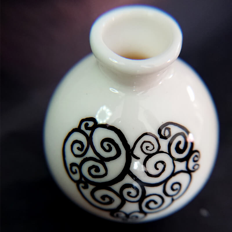 A tiny fine porcelain vase with glazed painting.  